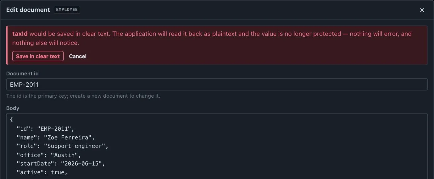 The same editor refusing to save: taxId would be written in clear text, with a Save in clear text button beside Cancel